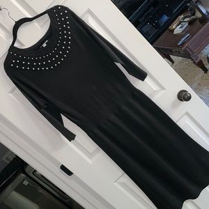 Black dress with pearls on front top. Elegant.